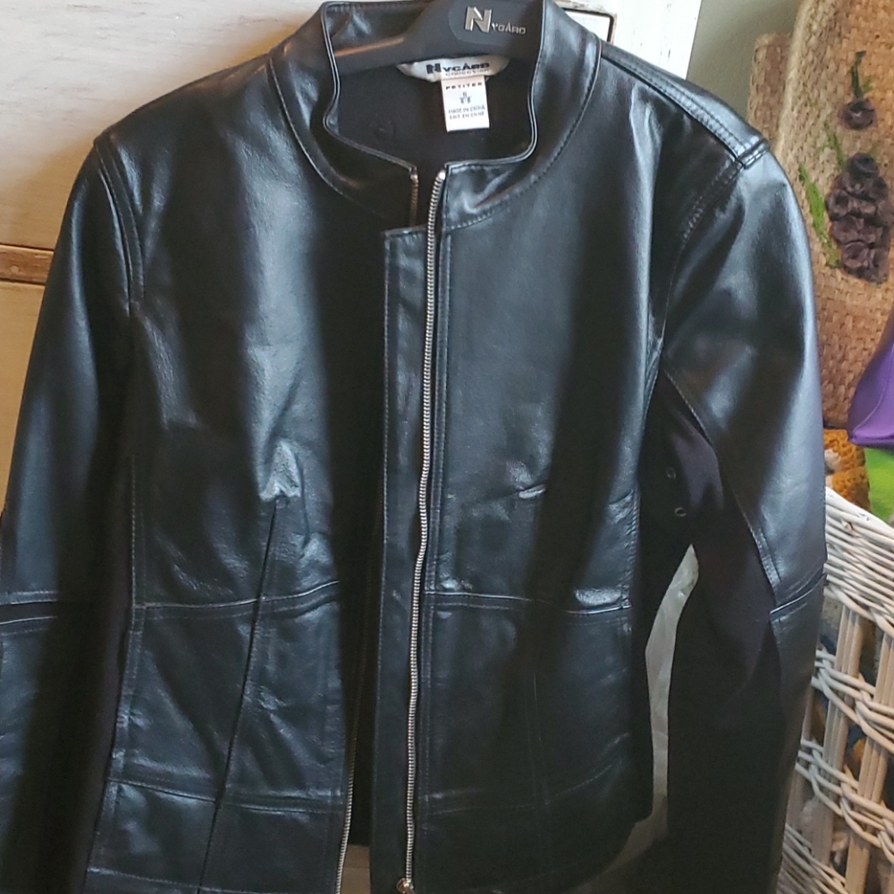 Black leather coat. PTP is 18 inches and length is 22